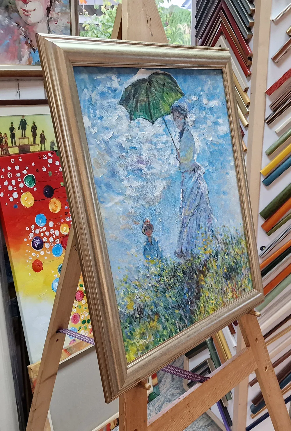 Claude Monet – Woman with a Parasol – angled on the easel, moulding samples behind – hand-painted oil on canvas