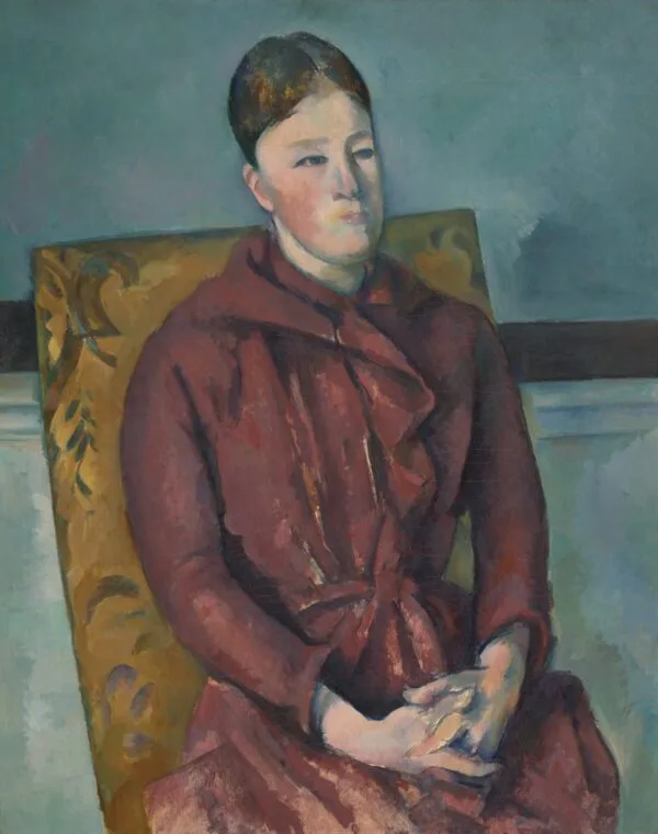 Paul Cézanne – Madame Cézanne con l'abito rosso. Donna seduta in abito rosso scuro con cintura, le mani intrecciate in grembo, su una poltrona gialla a motivi fogliati davanti a una parete grigio-azzurra, Paul Cézanne, 1888-1890, riproduzione su tela dipinta a mano