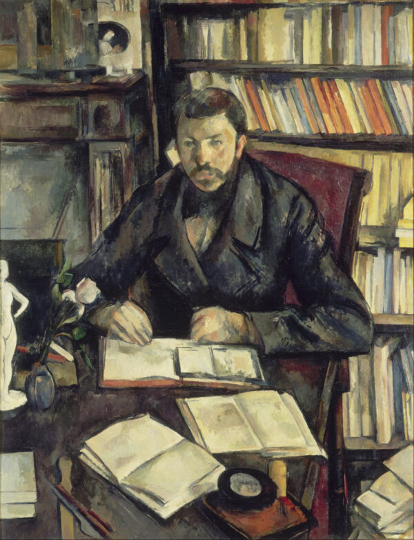 A moustached man sits at a table before a wall of bookshelves, his hands together over an open book, at the left a white plaster statuette and a white flower in a blue vase, Paul Cézanne, 1895–1896