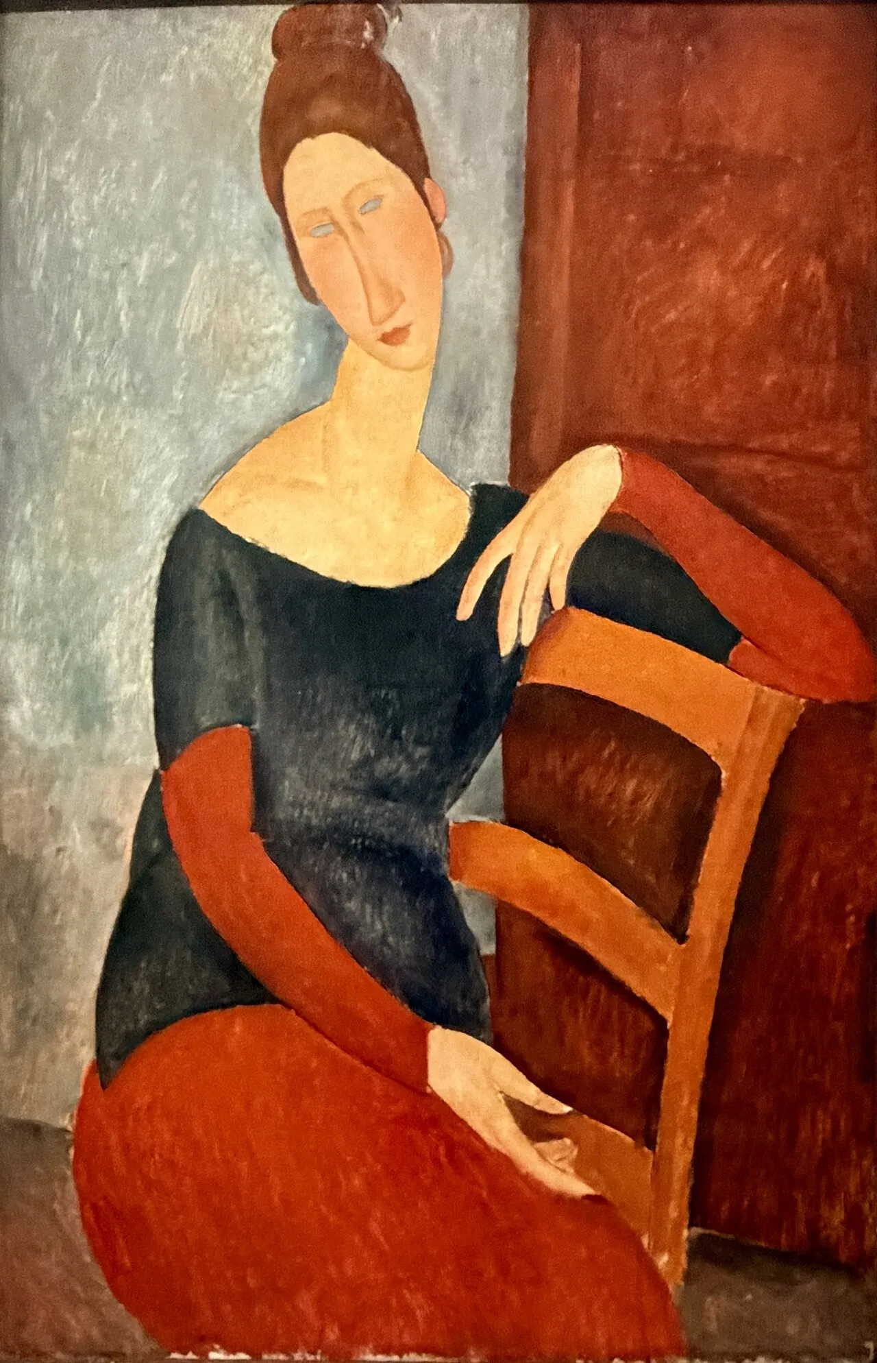 Amedeo Modigliani - Jeanne, sedeča z roko na naslonu stola - umetniška slika na platnu - ročno slikana reprodukcija