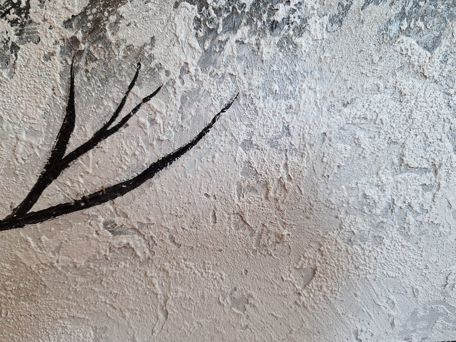 Tree in the night – close-up of the raised white and grey paint with a black branch