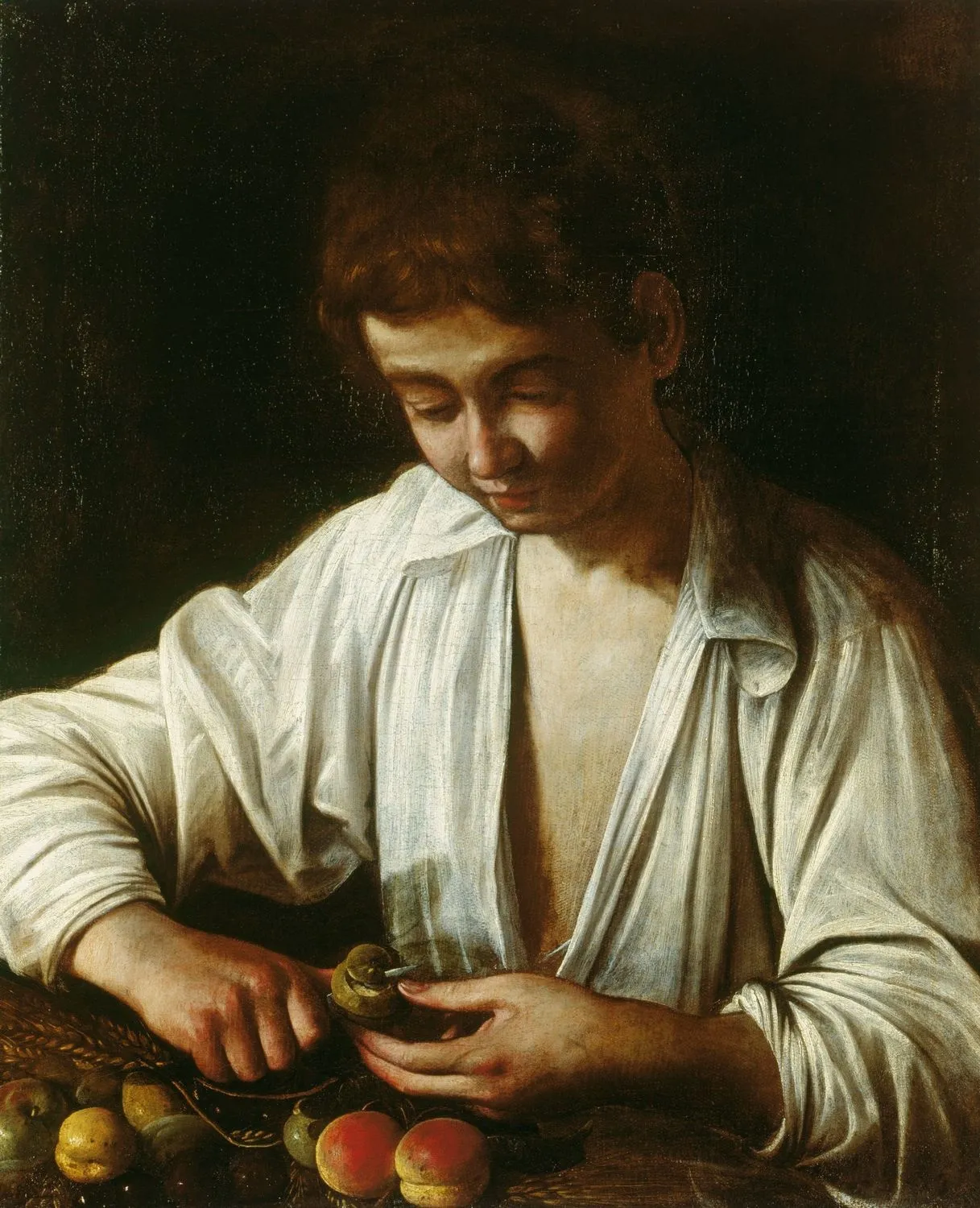 Caravaggio – Deček, ki lupi sadež – izvirnik iz okoli 1592–1593 v palači Hampton Court – olje na platnu